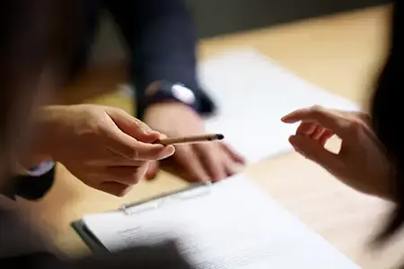 hands with paperwork